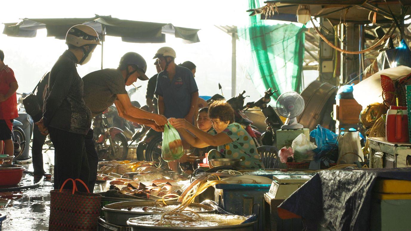 Fresh farm produce filling the wholesale sections of Sa Đéc Market.